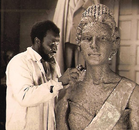 Enwonwu working on a bronze sculpture of Queen Elizabeth II.