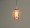 Natural bamboo rattan pendant lampshade handwoven in Rwanda. It emits a warm soft light and reflects the decorative pattern of the braided bamboo.