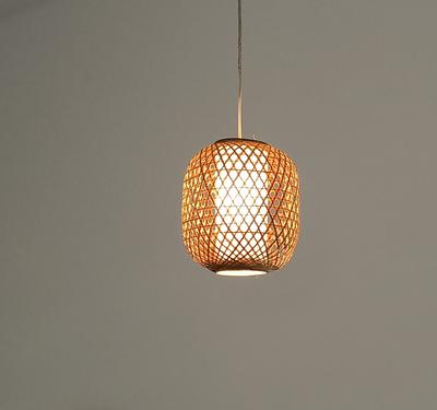 Natural bamboo rattan pendant lampshade handwoven in Rwanda. It emits a warm soft light and reflects the decorative pattern of the braided bamboo.