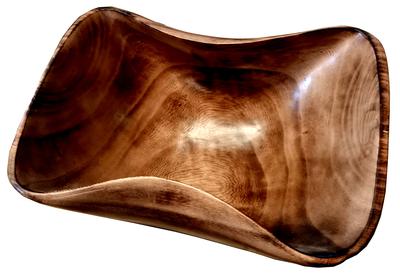 Wooden bowl hand carved from wild grained olive wood.                  Made in Kenya. Used to serve salads, fruit and snacks.